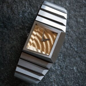 Toledano & Chan b/1.3r with 18k gold ripple dial and Grade 5 titanium bracelet